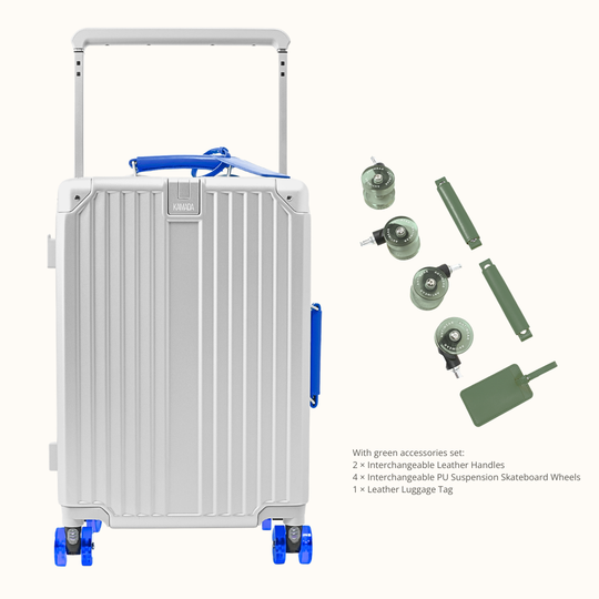A silver aluminum hard-shell suitcase with blue accents on the handle and wheels, shown alongside a set of green accessories including leather handles, four interchangeable PS suspension skateboard wheels, and a luggage tag on a light beige background.